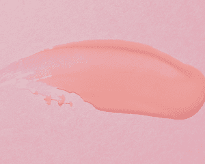 amostra de cera de cabelo em fundo rosa